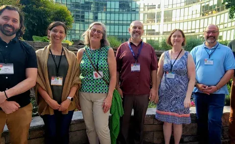 A group of UNE researchers poses outside at a conference in Washington, D.C.